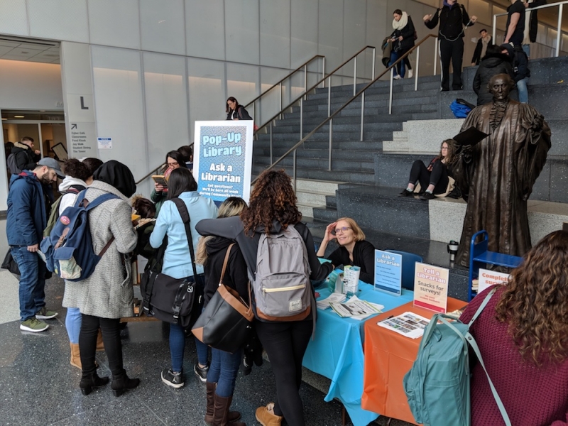 Students lining up at the table